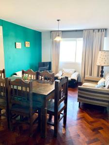 a living room with a table and chairs and a couch at Departamento Centrico in Mendoza