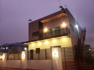 a house with lights on the side of it at Malik SuitesGY in Nismes