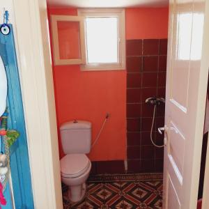 a bathroom with a toilet and a window at Sunrise house Alonnisos in Alonnisos +37 photos