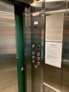 a elevator in a subway train with a sign on it at Casa Nostrum Priceless View Central Location 3BR 3BA in Punta del Este