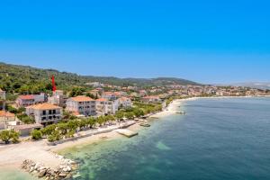 an aerial view of a beach with buildings and the ocean at Luxury villa Vincent in Slatine