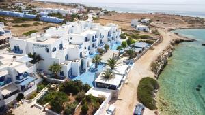 an aerial view of a beach with white buildings at Hotel Posidonion in Koufonisia