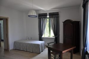 A bed or beds in a room at Res Nova Il Colle