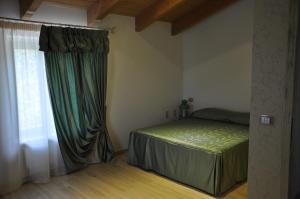 A bed or beds in a room at Res Nova Il Colle