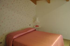 A bed or beds in a room at Res Nova Il Colle