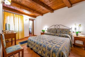 A bed or beds in a room at Albergo Falterona