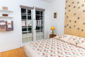 a bedroom with a bed and a window at Trails End Inn in Keene Valley