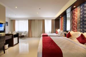 Postel nebo postele na pokoji v ubytování Ohana Hotel Kuta + 37 fotografií