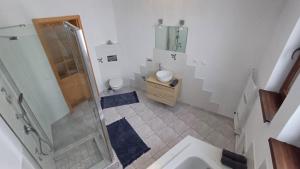 a bathroom with a shower and a sink at Domček pod Borom in Suchá Hora