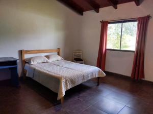 Una cama o camas en una habitación de Lo de Pascual
