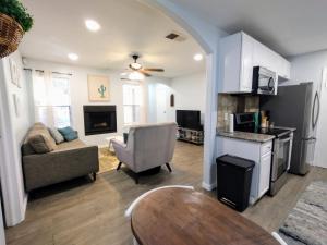 a living room with a couch and a table at Mountain Foot Condo - Near Tempe and PHX Airport in Phoenix