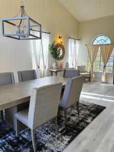 a dining room with a table and chairs at Fragrant Finnish Sauna & Cozy Pool with French 3br in Las Vegas