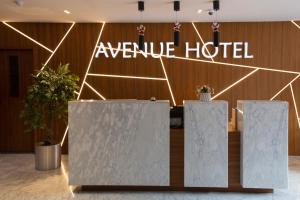a hotel lobby with a sign that reads avenue hotel at Avenue Hotel Tbilisi in Tbilisi City