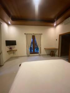 TV/Unterhaltungsangebot in der Unterkunft Pucuk Bali Homestay