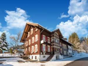 a building in the snow with a blue sky at Property in Sibratsgfäll in Sibratsgfäll