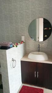 a bathroom with a sink and a mirror at Vista del Mar in Candidasa