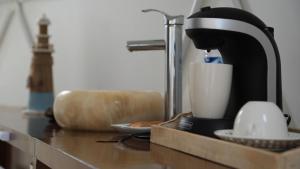 a mixer sitting on top of a counter with a cup at Cozy room near the beach, party zone in Tulum