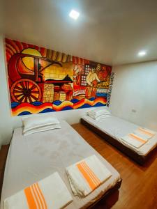 Postel nebo postele na pokoji v ubytování The Bistro House - Loft Unit - Vigan