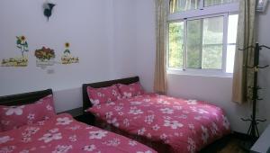 A bed or beds in a room at Cuiti B&B