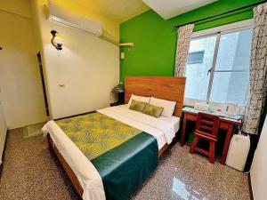 Ein Bett oder Betten in einem Zimmer der Unterkunft Village Hostel