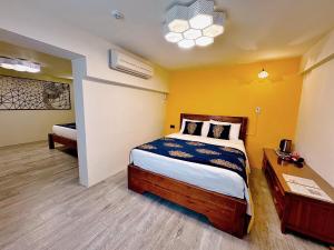 Ein Bett oder Betten in einem Zimmer der Unterkunft Village Hostel