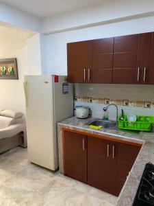 Kuchyň nebo kuchyňský kout v ubytování Apartamento en sandona