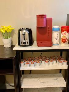 a shelf with cupcakes and a coffee maker on it at Vito Place in Halifax