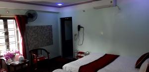 Postel nebo postele na pokoji v ubytování Đại Loan Sapa Hotel