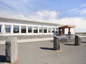 a building with bikes parked in front of it at KEF Guesthouse by Keflavík airport in Keflavík