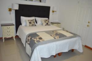 En eller flere senge i et værelse på Hotel Boutique Amalfi