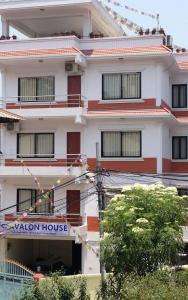 a building with a sign for a vacation house at Avalon House in Kathmandu