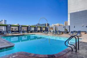 a large swimming pool on the roof of a building at Princess Suite * Platinum Hotel with balcony Strip VIEW in Las Vegas