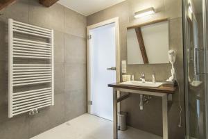 a bathroom with a sink and a mirror at Largo in Český Krumlov +22 photos