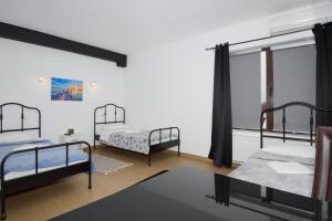 Postel nebo postele na pokoji v ubytování Hotel ENZO