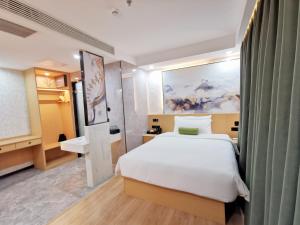 Postel nebo postele na pokoji v ubytování Connar Hotel - Shenzhen Futian