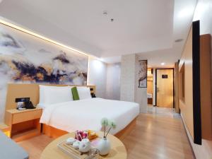 Postel nebo postele na pokoji v ubytování Connar Hotel - Shenzhen Futian