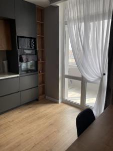 Kuchyňa alebo kuchynka v ubytovaní VIP квартира в центре города, новостойка в ЖК Prestige Apаrtments, Ровно