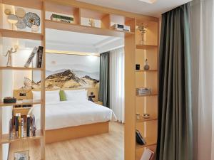 Postel nebo postele na pokoji v ubytování Connar Hotel - Shenzhen Futian + 37 fotografií