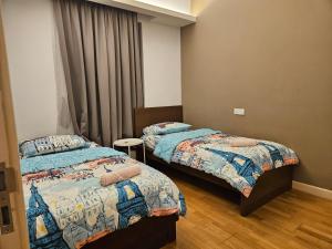 Ένα ή περισσότερα κρεβάτια σε δωμάτιο στο The Wisdom Apartment