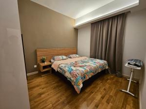 Ένα ή περισσότερα κρεβάτια σε δωμάτιο στο The Wisdom Apartment