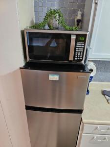 a microwave oven sitting on top of a refrigerator at Coral Resort D4 in Clearwater Beach