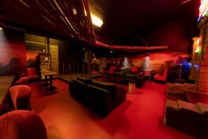 a room with couches and chairs in a theatre at FDTD Party & Sauna Lounge in Lahti