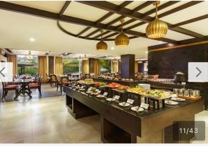 a buffet in a hotel room with a lot of food at Aloha - Luxury Apartments by blissful Ganges in Rishīkesh