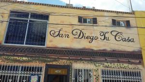 a sign on the side of a building at San Diego Tu Casa in Campeche