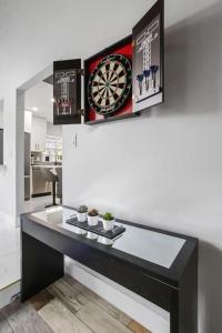 a counter with a dart board on a wall at Escondida Drive in West Palm Beach