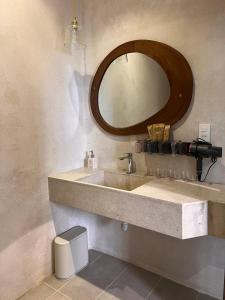 a bathroom with a sink and a mirror at Komi Homestay in Hue