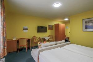 Postel nebo postele na pokoji v ubytování Hotel Ideal