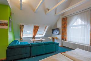 TV a/nebo společenská místnost v ubytování Hotel Ideal