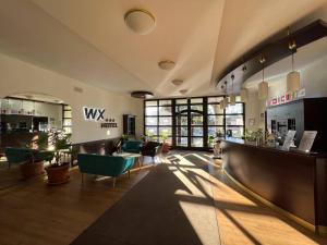 TV a/nebo společenská místnost v ubytování WX Hotel