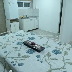 a room with a bed with a tray on it at Acogedor y familiar departamento c est in Santiago del Estero